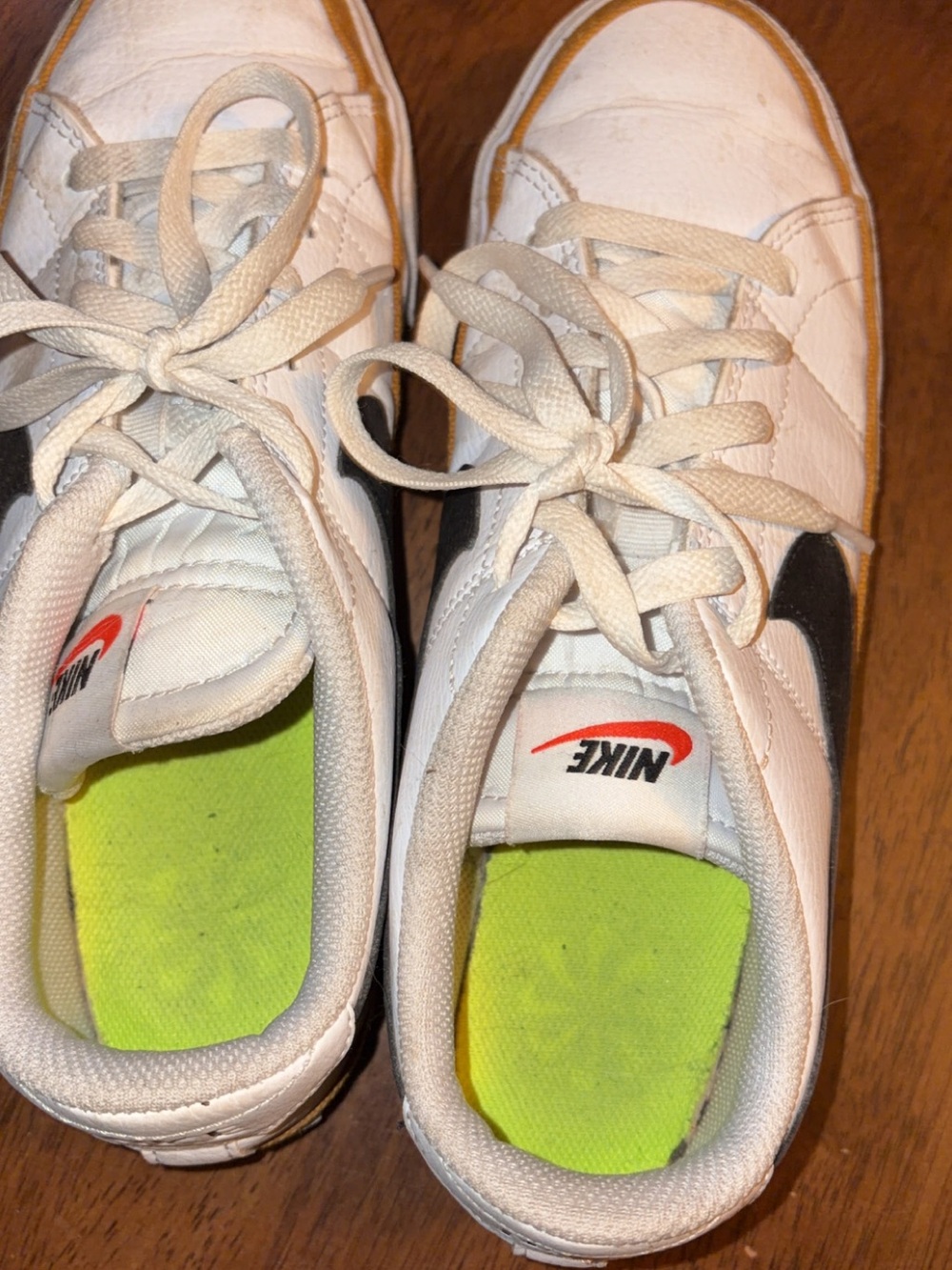 Nike Kids White Sneakers with Black Swoosh and Neon Green Insole